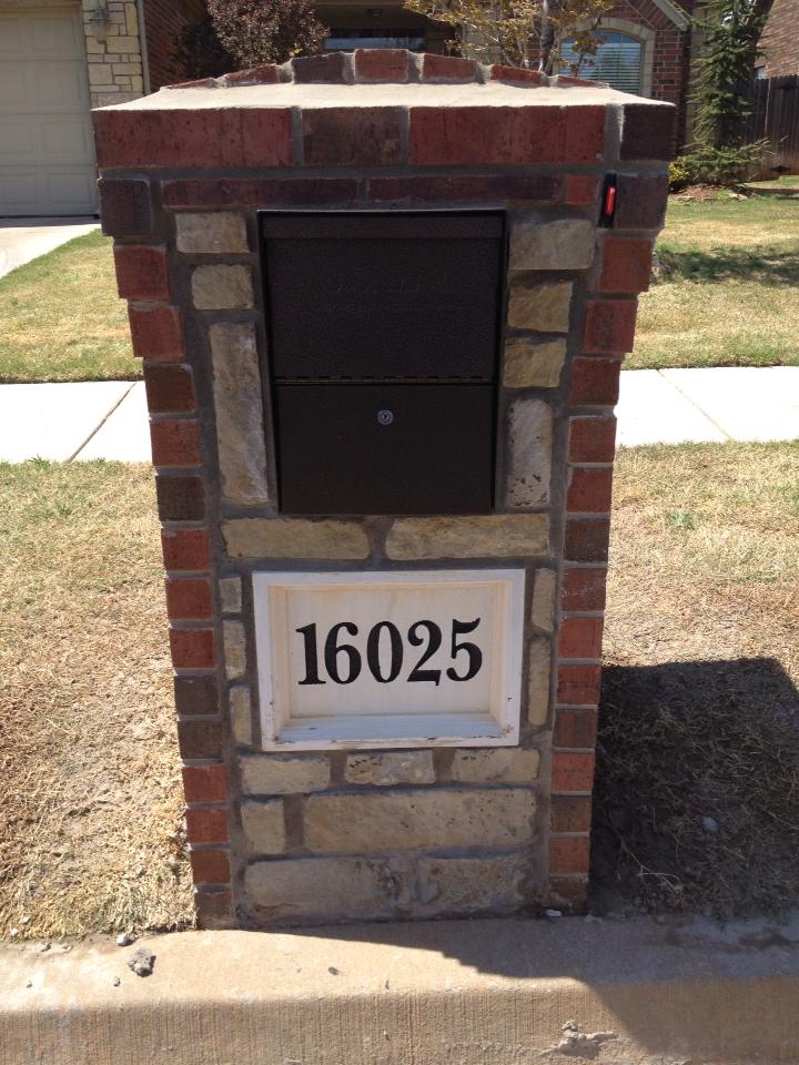 Photo: Bronze Package Master in Brick Column